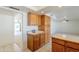 Bright kitchen with ample cabinetry and a breakfast bar at 2818 S Cottonwood Dr, Tempe, AZ 85282