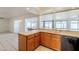 View of kitchen with double sink and access to backyard at 2818 S Cottonwood Dr, Tempe, AZ 85282