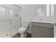 Clean bathroom with a shower/tub combo and gray vanity at 2820 W Eagle Talon Rd, Phoenix, AZ 85085