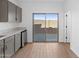 Modern kitchen with gray cabinets and sliding glass door at 2820 W Eagle Talon Rd, Phoenix, AZ 85085