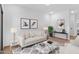 Living room with light colored sofas and wood floors at 2820 W Eagle Talon Rd, Phoenix, AZ 85085