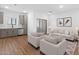 Open concept living room and kitchen with wood floors at 2820 W Eagle Talon Rd, Phoenix, AZ 85085