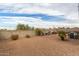 Backyard with gravel, fire pit, and block wall at 3224 N Lainey Ln, Buckeye, AZ 85396