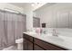 Bathroom with double vanity, shower, and a large mirror at 3224 N Lainey Ln, Buckeye, AZ 85396