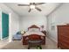 Cozy bedroom with a wooden bed frame and dresser at 3224 N Lainey Ln, Buckeye, AZ 85396