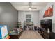 Bright playroom featuring built-in shelving and a large TV at 3224 N Lainey Ln, Buckeye, AZ 85396