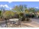 Relaxing backyard patio with seating area and a stone pathway at 34476 N 68Th Way, Scottsdale, AZ 85266