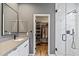 Bright bathroom features a walk-in closet and a marble shower at 34476 N 68Th Way, Scottsdale, AZ 85266