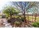 Landscaped backyard with stone pathway and desert plants at 36038 N Puente Alto Ave, Queen Creek, AZ 85140