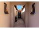 Light and airy entryway with tiled floors and wall-mounted lights at 36038 N Puente Alto Ave, Queen Creek, AZ 85140