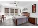 Spacious main bedroom with wood furniture and ceiling fan at 36038 N Puente Alto Ave, Queen Creek, AZ 85140