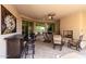 Relaxing covered patio with fireplace and seating area at 36038 N Puente Alto Ave, Queen Creek, AZ 85140