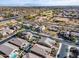 Scenic aerial view of a desert community, highlighting golf course and neighborhood streets at 3933 E Alfalfa Dr, Gilbert, AZ 85298