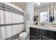 Well-lit bathroom with a shower and stylish fixtures at 3933 E Alfalfa Dr, Gilbert, AZ 85298