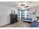 A bedroom featuring a bed with blue bedding, a dresser, and striped curtains at 3933 E Alfalfa Dr, Gilbert, AZ 85298