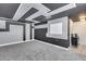 Spacious bonus room with an elaborate black and gray painted design on walls and ceiling and new gray carpeting at 3933 E Alfalfa Dr, Gilbert, AZ 85298