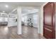 Bright and airy entryway with hardwood floors leading into the spacious living area at 3933 E Alfalfa Dr, Gilbert, AZ 85298