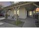 Charming covered front porch with stone accents and cozy seating area at 3933 E Alfalfa Dr, Gilbert, AZ 85298