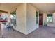 Close-up of a covered front porch with cozy seating and textured exterior walls at 3933 E Alfalfa Dr, Gilbert, AZ 85298