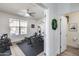 Home gym with ceiling fan, natural light, and exercise equipment promotes an active lifestyle and wellness routines at 3933 E Alfalfa Dr, Gilbert, AZ 85298