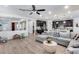 Open-concept living room flowing into kitchen, perfect for entertaining and modern living at 3933 E Alfalfa Dr, Gilbert, AZ 85298