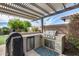 Outdoor kitchen boasts a built-in grill and stainless steel mini-fridge for convenient outdoor cooking and entertaining at 3933 E Alfalfa Dr, Gilbert, AZ 85298