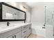 Elegant bathroom with double vanity, soaking tub, and glass shower at 4041 E Lexington Ave, Gilbert, AZ 85234