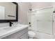 Clean bathroom with single vanity, tub, and shower at 4041 E Lexington Ave, Gilbert, AZ 85234