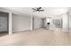 Living room features light gray walls, wood-look floors, and access to other rooms at 4041 E Lexington Ave, Gilbert, AZ 85234