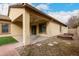 Spacious backyard patio with ceiling fan and firepit at 4041 E Lexington Ave, Gilbert, AZ 85234