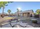 Landscaped backyard with a pool and flagstone walkway at 4056 E Rosemonte Dr, Phoenix, AZ 85050