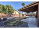 Backyard with covered patio, landscaping and a pool at 4056 E Rosemonte Dr, Phoenix, AZ 85050