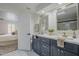 Elegant bathroom with double vanity and view of bedroom at 4056 E Rosemonte Dr, Phoenix, AZ 85050