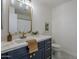 Elegant bathroom featuring a stylish vanity and gold fixtures at 4056 E Rosemonte Dr, Phoenix, AZ 85050