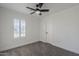 Bright bedroom with ceiling fan and plantation shutters at 4056 E Rosemonte Dr, Phoenix, AZ 85050