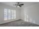 Well-lit bedroom with ceiling fan and plantation shutters at 4056 E Rosemonte Dr, Phoenix, AZ 85050