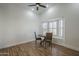 Small breakfast nook with wooden table and chairs near a window at 4056 E Rosemonte Dr, Phoenix, AZ 85050