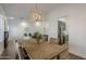 Bright dining area with kitchen view and wood floors at 4056 E Rosemonte Dr, Phoenix, AZ 85050