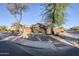 Single-story home with a two-car garage and desert landscaping at 4056 E Rosemonte Dr, Phoenix, AZ 85050