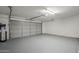 Garage with overhead door and epoxy flooring at 4056 E Rosemonte Dr, Phoenix, AZ 85050