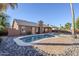 Inviting kidney shaped pool with brick patio and rock landscaping at 4056 E Rosemonte Dr, Phoenix, AZ 85050