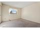 Simple bedroom with carpet flooring and a window at 4079 E Yucca St, Phoenix, AZ 85028