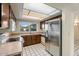 Kitchen features stainless steel appliances and wood cabinets at 4079 E Yucca St, Phoenix, AZ 85028