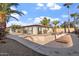 Large swimming pool with surrounding gravel and landscaping at 4079 E Yucca St, Phoenix, AZ 85028