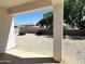 Landscaped backyard with covered patio at 42025 W Manderas Ln, Maricopa, AZ 85138