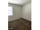 Bright bedroom featuring carpet and window at 42025 W Manderas Ln, Maricopa, AZ 85138