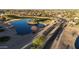 Aerial view of community with lake, golf course, and entrance at 4229 E Crest Ct, Gilbert, AZ 85298