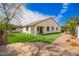 The backyard features manicured lawn, patio, and mature landscaping providing a private outdoor retreat at 4229 E Crest Ct, Gilbert, AZ 85298