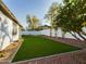 Backyard with artificial turf, and a lemon tree at 4229 E Crest Ct, Gilbert, AZ 85298