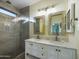 Bathroom with double vanity, marble countertop, and large walk-in shower at 4229 E Crest Ct, Gilbert, AZ 85298